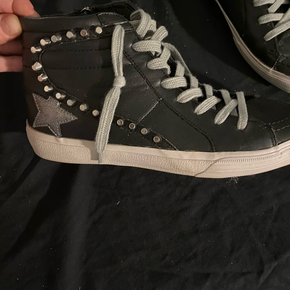 Black high top sneakers with stud detail